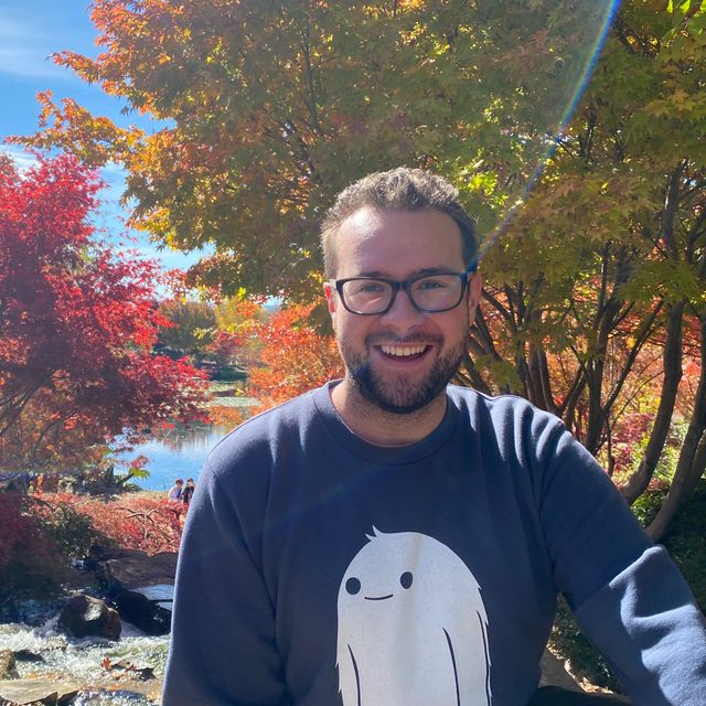 A photo of Mitchell Busby smiling at the camera